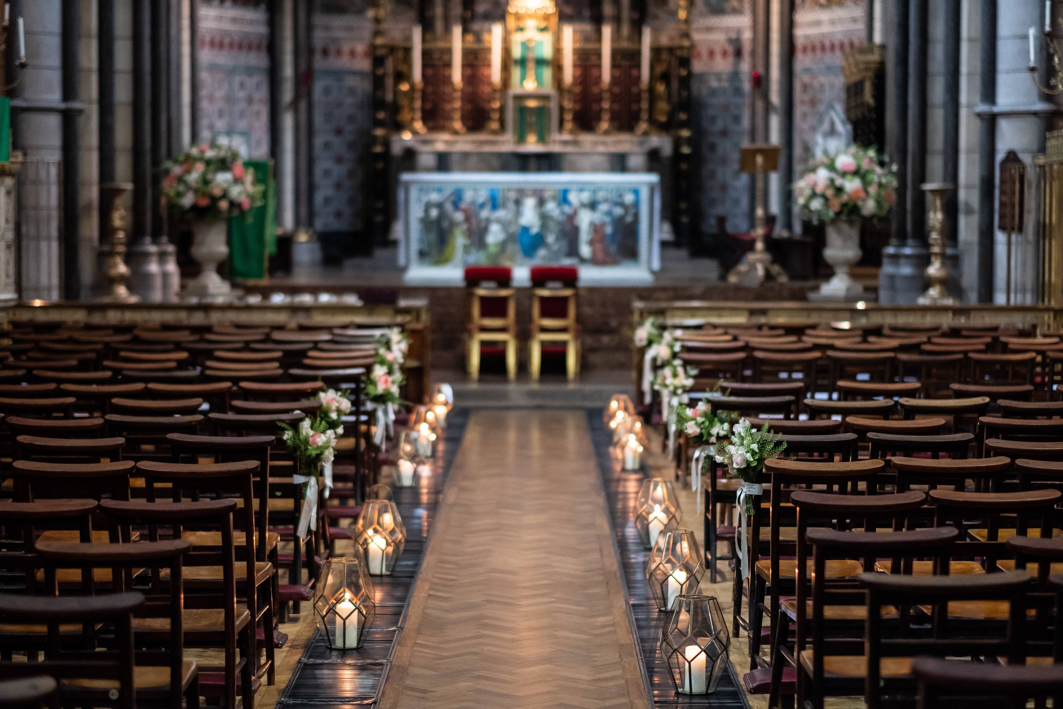 Wedding at St James' Church, London Church Ceremony, Pew ends. Geometric lanterns